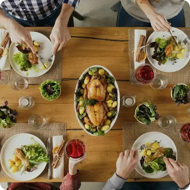 A group of people enjoying a big dinner together.