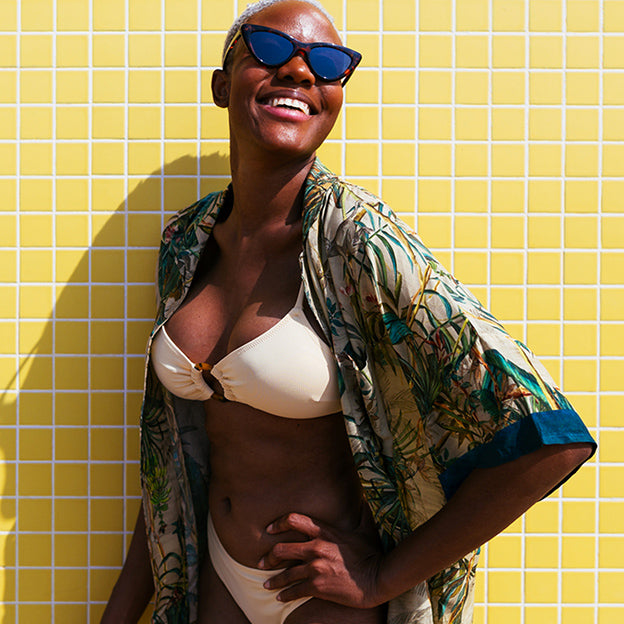 Woman smiling in bathing suit.
