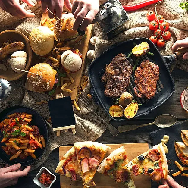 People enjoying an assortment of food.
