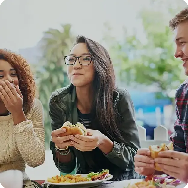 A group of people enjoying a meal together.