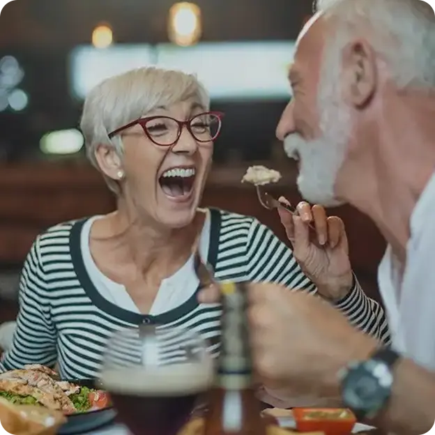 A couple enjoying a meal together.